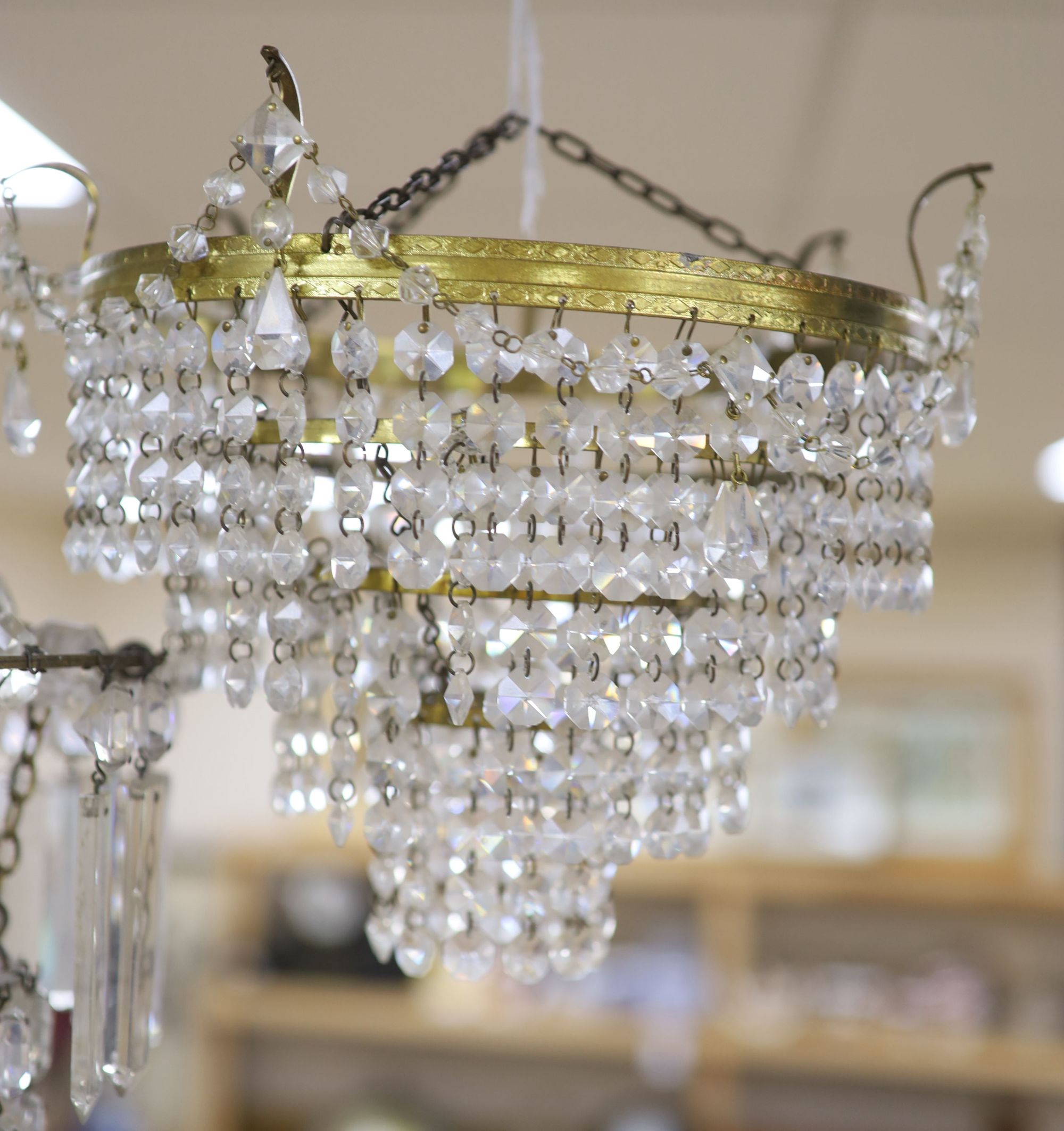 A glass lustre chandelier and another